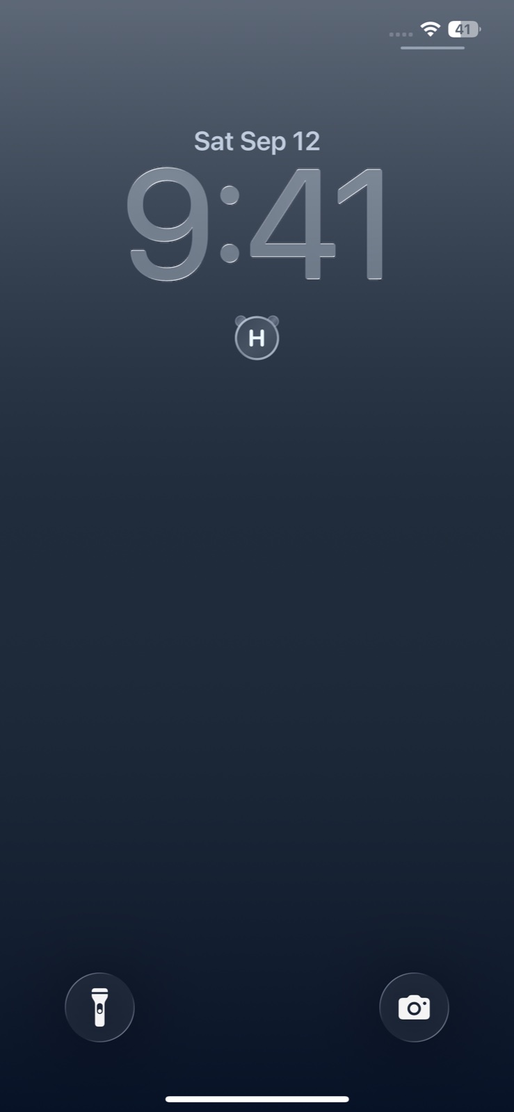 An iPhone Lock Screen with the PANDA MONO H widget